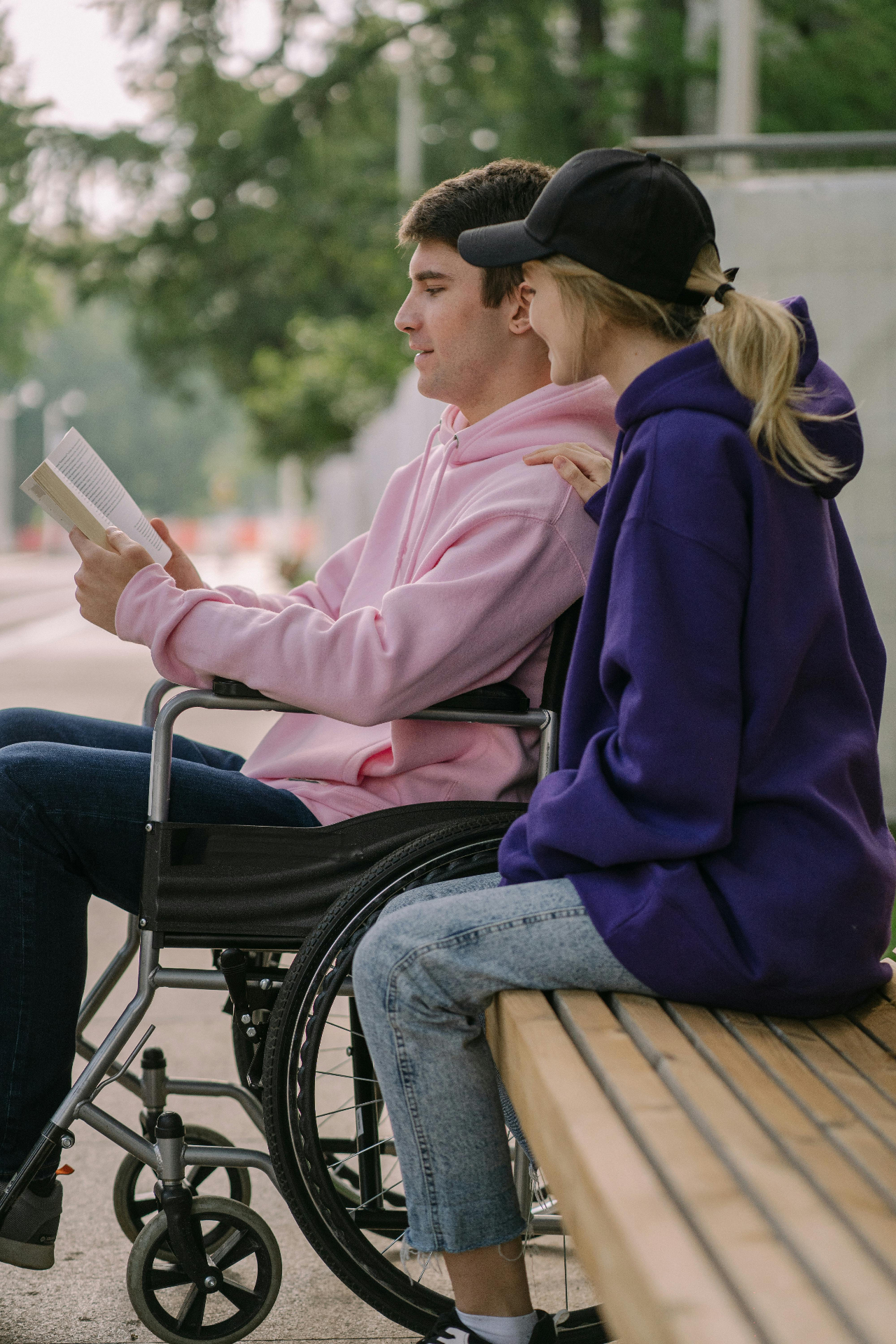Support worker helping elderly person use a tablet