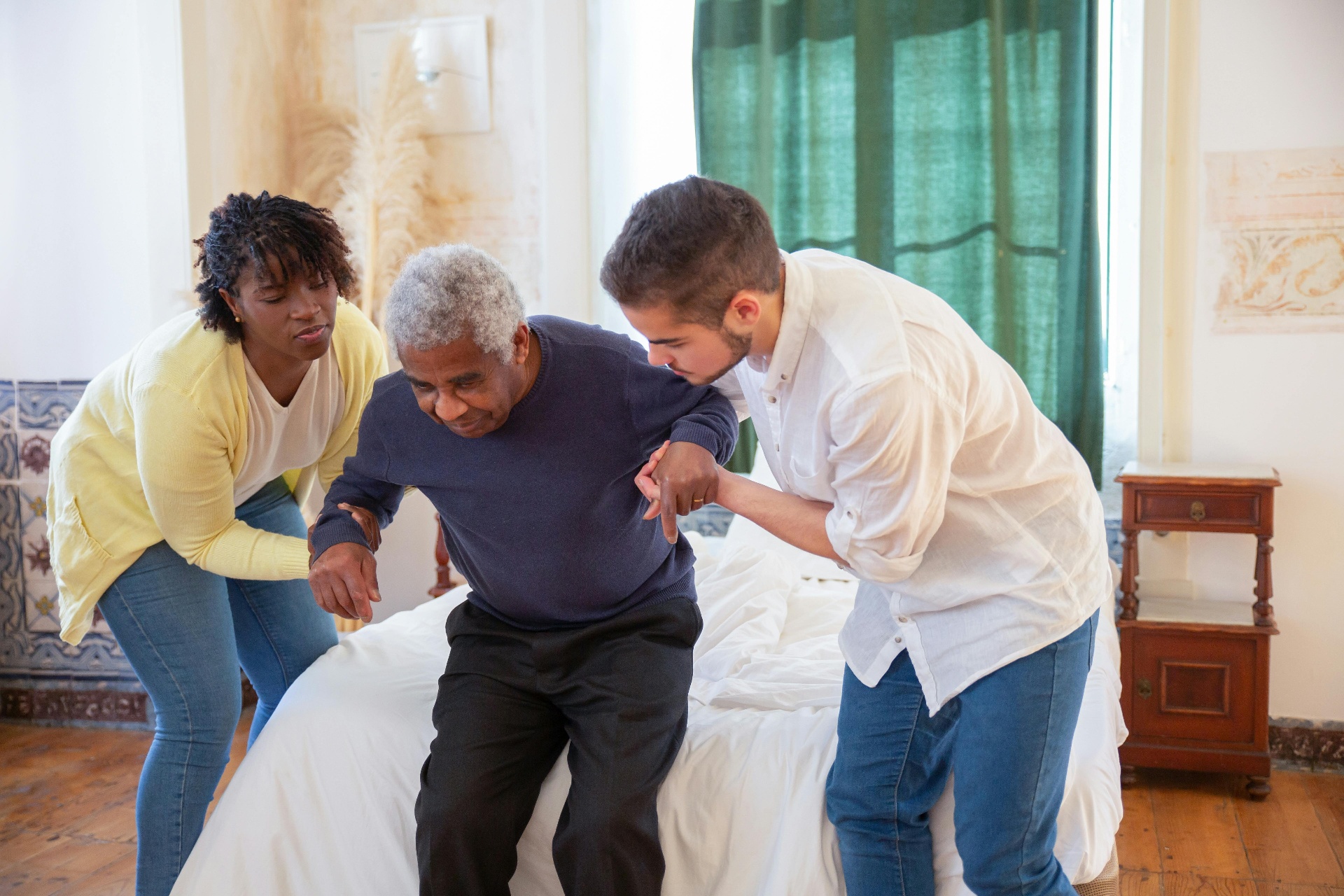 Care worker assisting elderly person at home