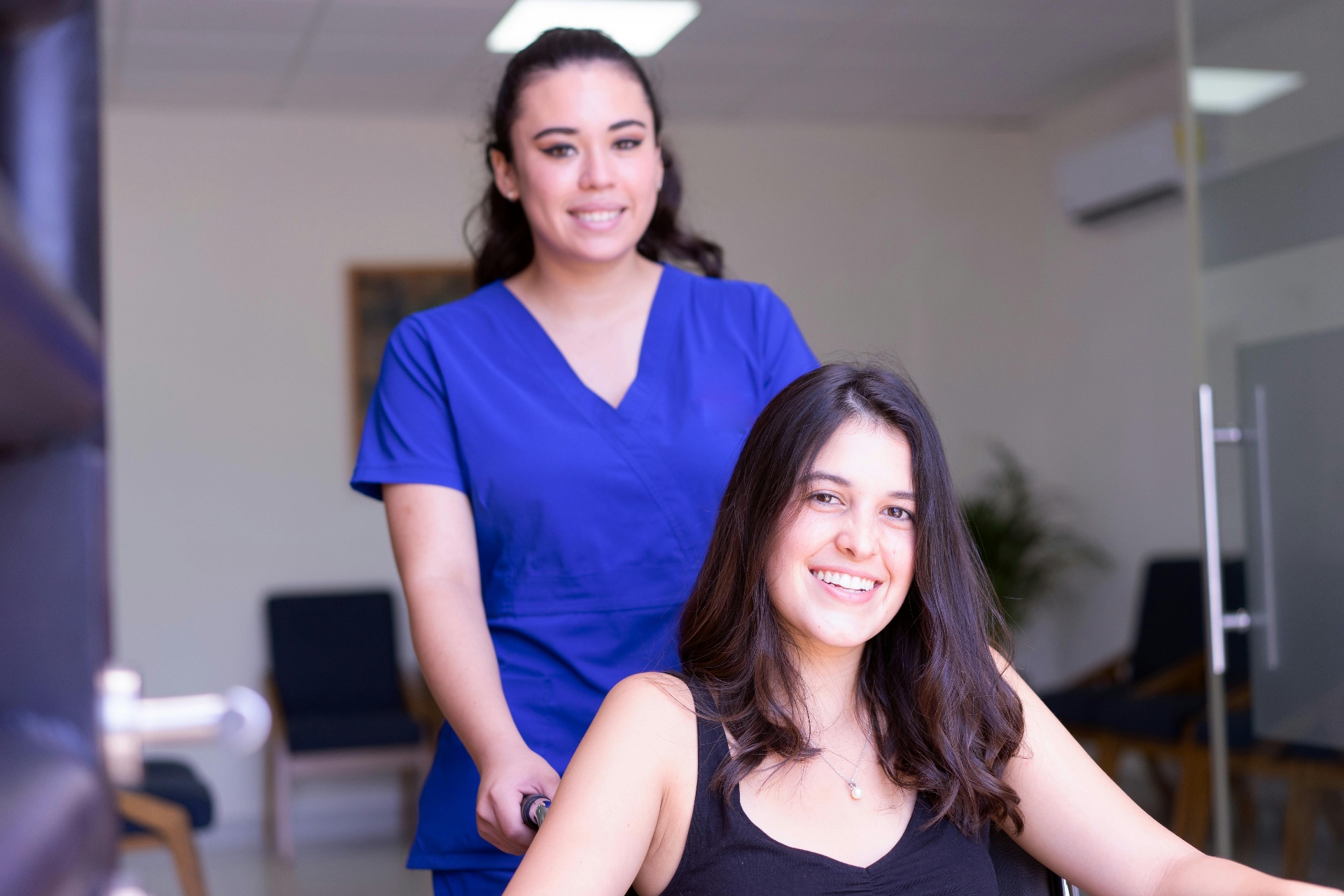 Nurse checking patient blood pressure