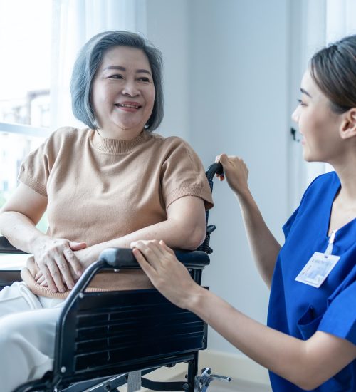 asian-nurse-take-care-senior-woman-on-wheelchair-at-nursing-home-care-